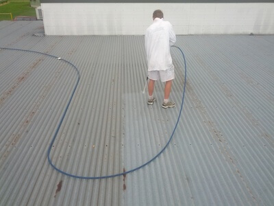 Rusty roof repaired and painted by Scott Downing